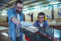 Father and son working with wood Royalty Free Stock Photo