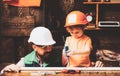 Father and sons are are building the furniture at home. Little construction worker. Father shows his little son how to Royalty Free Stock Photo