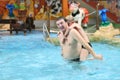 Father and sons having fun in swimming pool Royalty Free Stock Photo