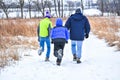Father and Sons Hiking Through Snow Covered Nature Preserve Royalty Free Stock Photo