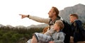 Father with sons on the mountain walk