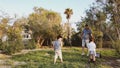 Father and sons playing in the park