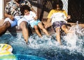 Father and sons playing in a pool