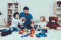 Father and Sons is Playing with Toys Royalty Free Stock Photo