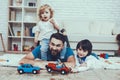 Father and Sons is Playing with Toys Royalty Free Stock Photo