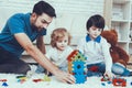 Father and Sons is Playing with Toys Royalty Free Stock Photo