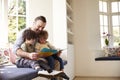 Father And Sons Reading Story At Home Together Royalty Free Stock Photo