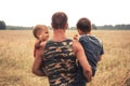 Father sons in rural wheat field farmer lifestyle portrait concept family care Royalty Free Stock Photo