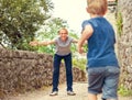 Father spreads his arms to embrace approaching son Royalty Free Stock Photo