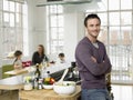 Father Standing Arms Crossed At Kitchen Counter