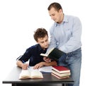 Father standing near son's desk helping him doing his homework Royalty Free Stock Photo