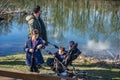 Father with two children is walking along the Aare river in springtime Royalty Free Stock Photo