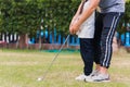 Father support teaching training daughter to play perfect golf Royalty Free Stock Photo