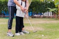 Father support teaching training daughter to play perfect golf Royalty Free Stock Photo