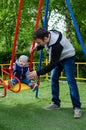 Father swinging his baby Royalty Free Stock Photo