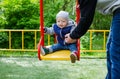 Father swinging his baby Royalty Free Stock Photo