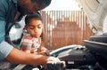 Father, tablet and child learning about car problem with diagnostic software for mechanic repair. Black man and daughter