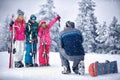 Father take photographing family on vacation in snow mountains Royalty Free Stock Photo