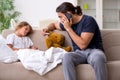 Father taking care of his ill daughter Royalty Free Stock Photo