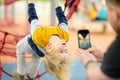 Father is taking a shot of his son having fun during stroll on outdoor playground. Active sport leisure for family with kids. Royalty Free Stock Photo