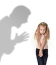 Father or teacher shadow screaming angry reproving young sweet little schoolgirl or daughter Royalty Free Stock Photo