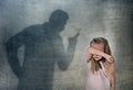 Father or teacher shadow screaming angry reproving young sweet little schoolgirl or daughter Royalty Free Stock Photo