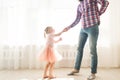 Father teaches to dance his cute little daughter. Royalty Free Stock Photo