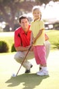 Father Teaching Daughter To Play Golf Royalty Free Stock Photo