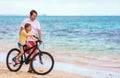 Father teaching daughter to ride bike Royalty Free Stock Photo