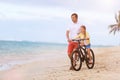 Father teaching daughter to ride bike Royalty Free Stock Photo