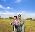 Father teaching his daughter to ride bicycle Royalty Free Stock Photo