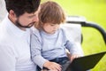 Father teaching his daughter using laptop computer, child and technology Royalty Free Stock Photo