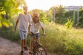 Father teaching his son how to ride a bicycle Royalty Free Stock Photo