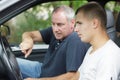 father teaching son to drive car Royalty Free Stock Photo