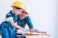 Father teaching his son to fo the DIY home improvement work for parent and family bonding concept Royalty Free Stock Photo