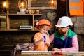 Father teaching little son to use Carpenter tools, screwdriver and screw. Royalty Free Stock Photo