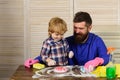 Father is Teaching a son a cleaning. Happy family cleans the room. Dad and child girl are dusting, washing floor and