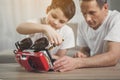 Father is teaching son how to repair toy transport Royalty Free Stock Photo