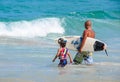 Father teaching son how to surfing.