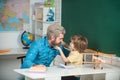 Father teaching son. Supporting pupils at school. Education background. Elementary school tutorship. Funny little child Royalty Free Stock Photo