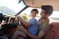 Father Teaching Young Son To Drive Car On Road Trip Royalty Free Stock Photo