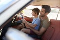 Father Teaching Young Son To Drive Car On Road Trip Royalty Free Stock Photo