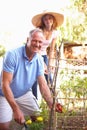 Father And Teenage Daughter Relaxing In Garden Royalty Free Stock Photo