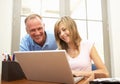 Father And Teenage Daughter Using Laptop At Home Royalty Free Stock Photo