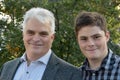 Father and teenage son posing for photos Royalty Free Stock Photo