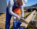 Father with toddler son building wooden frame house. Royalty Free Stock Photo