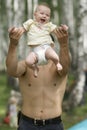 Father toss up his baby Royalty Free Stock Photo