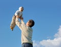 Father tossing baby