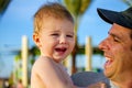 Father Tries to Cheer His Toddler Son Up Royalty Free Stock Photo
