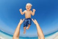 Father trowing up high in the air a happy child Royalty Free Stock Photo